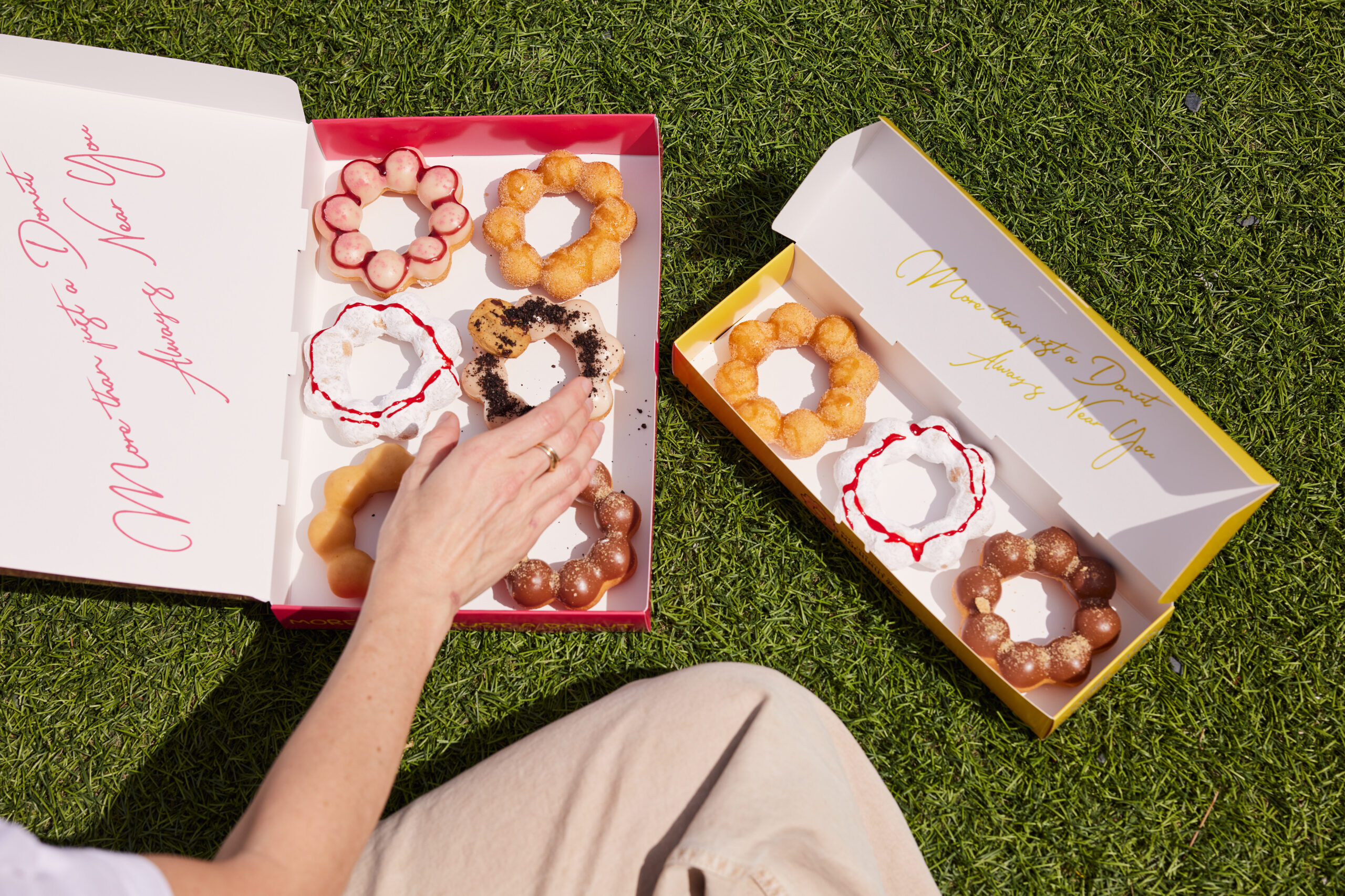 boxes of mochinuts on grass